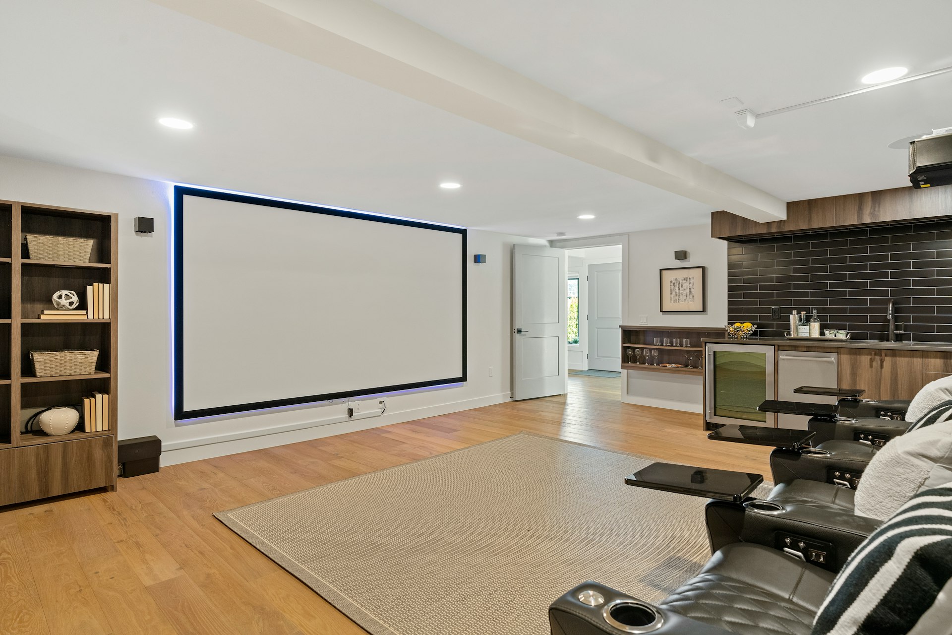 a living room with a large projection screen